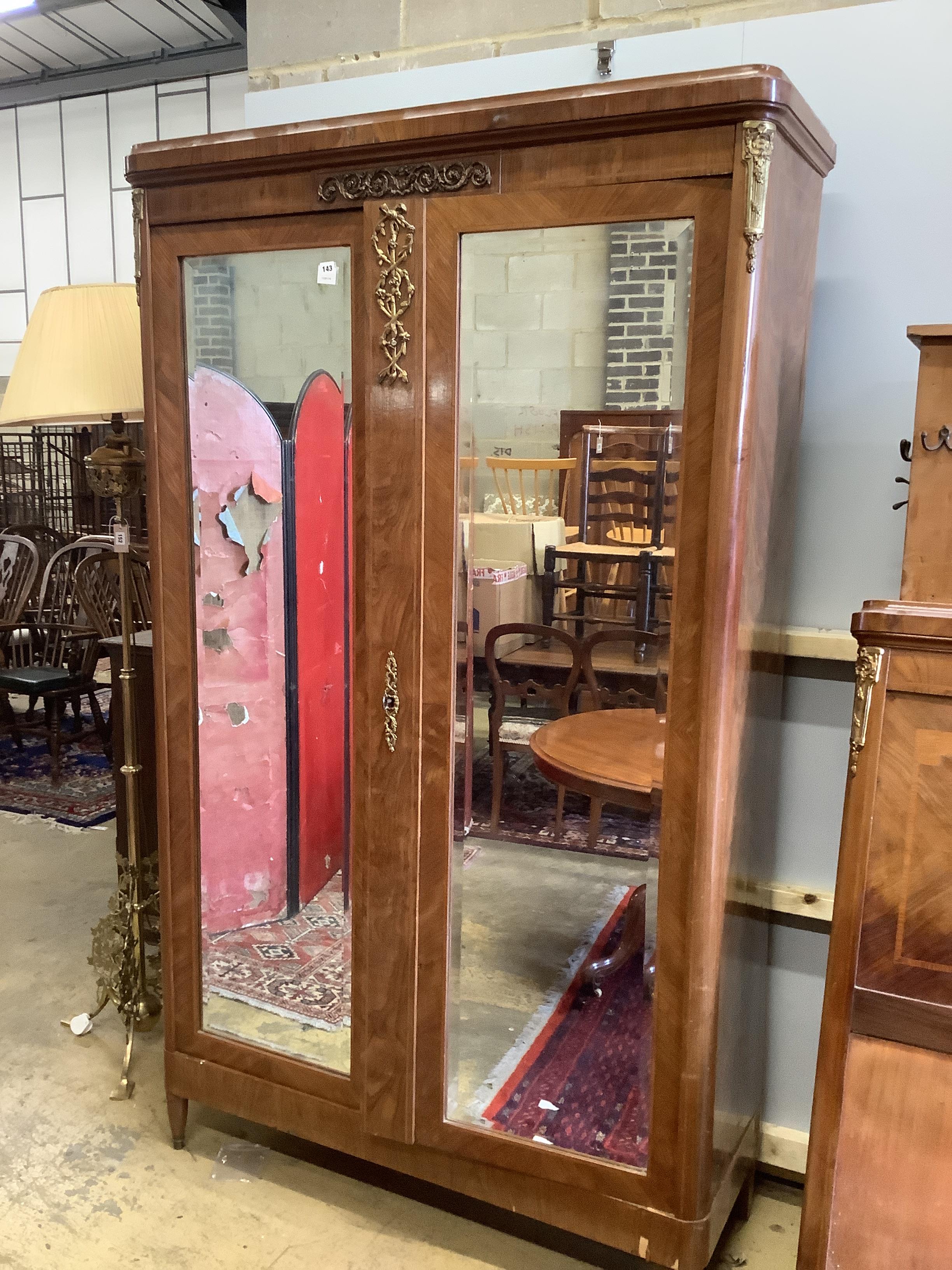 An early 20th century French gilt metal mounted kingwood mirrored armoire, width 120cm, depth 47cm, height 218cm together with a matching headboard